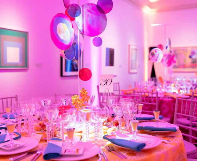 Multicolored tablescape featuring silk hoops made by Creative Aging participants, inspired by Linling Lu’s Soundwaves.
