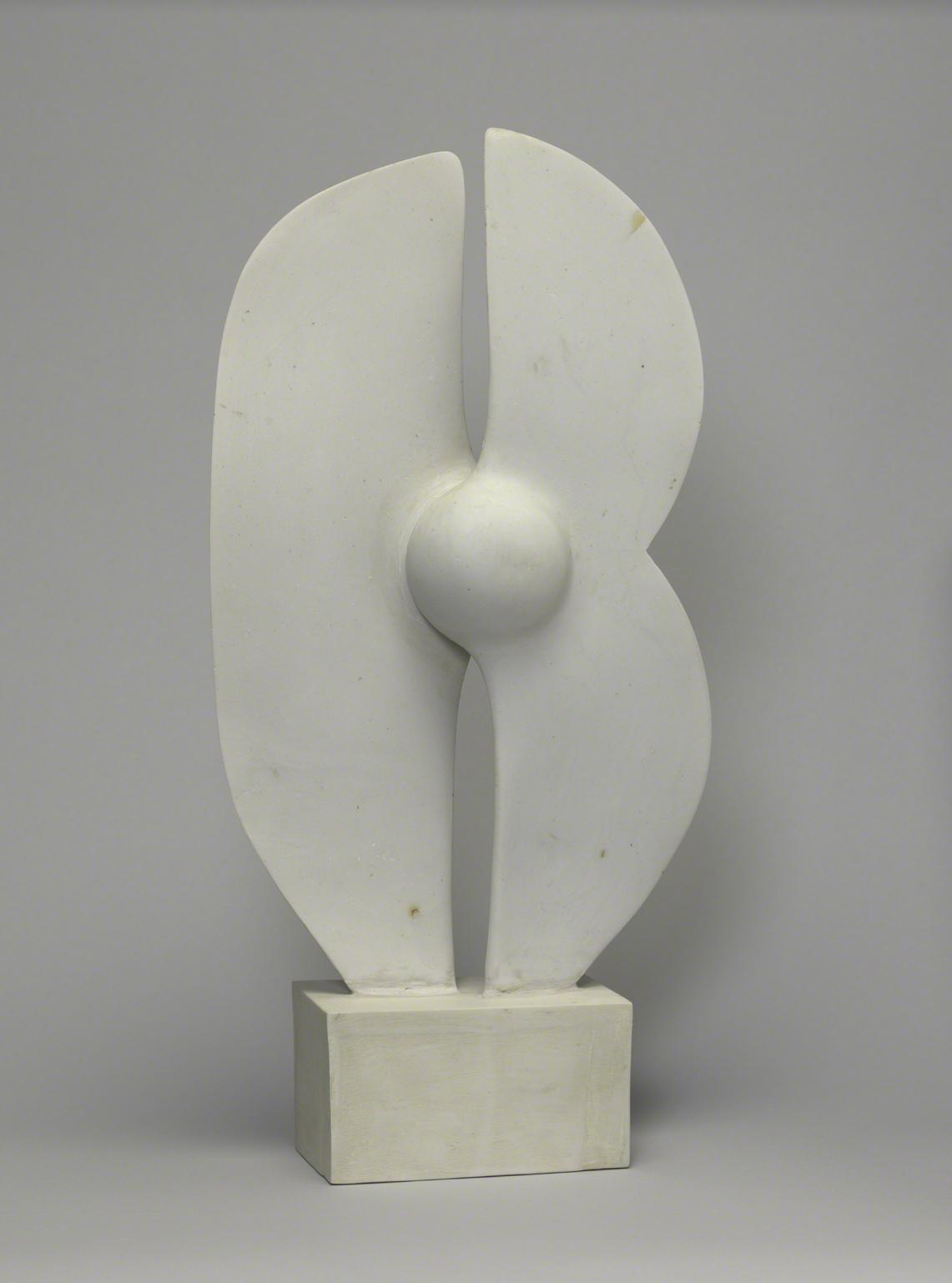 White, porcelain sculpture with two blades attached by central sphere. 