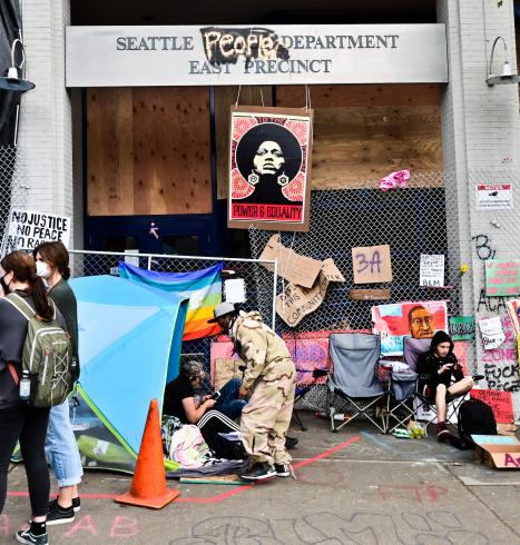 Photograph of people camped out by the Seattle Police Department 