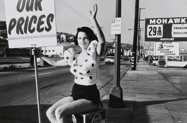 Girl Waving with Sign on Road (Los Angeles series)