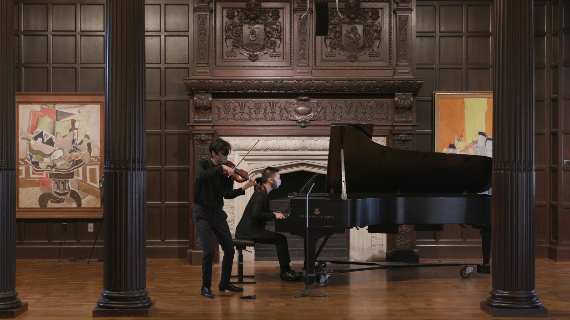 Photo of violinist and pianist performing in the Music Room