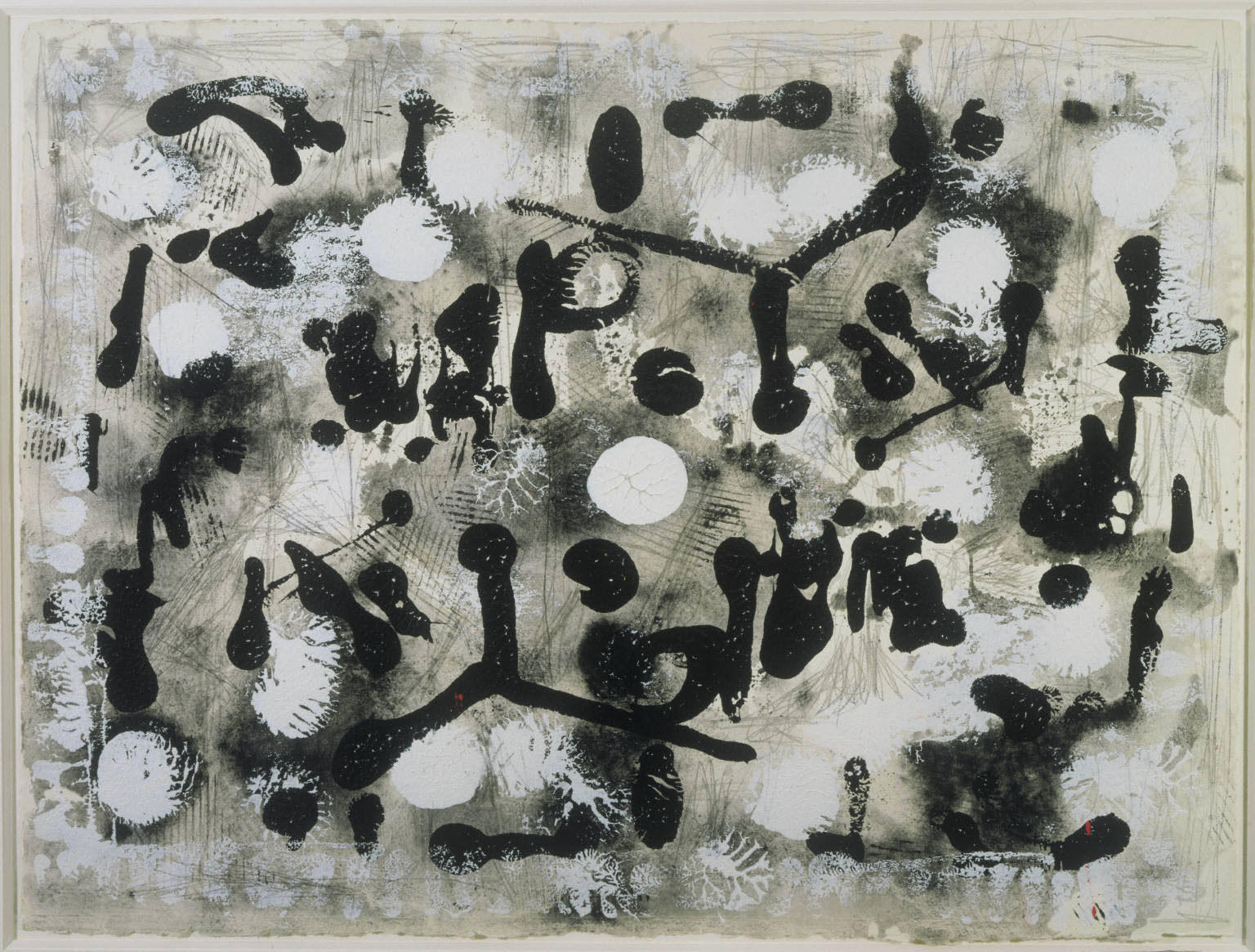 An abstract work on paper of black and white shapes and splatters