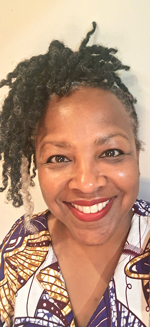 Photograph of Tiffane White close to the camera with a big smile
