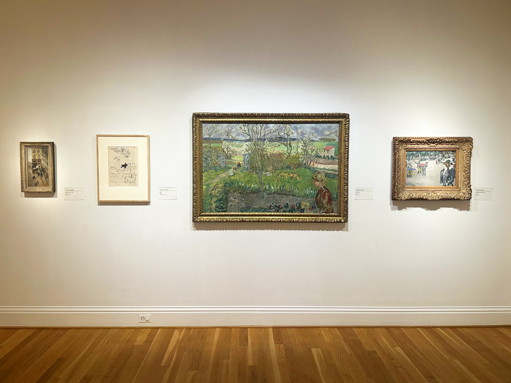 Four works by Bonnard hung on a wall