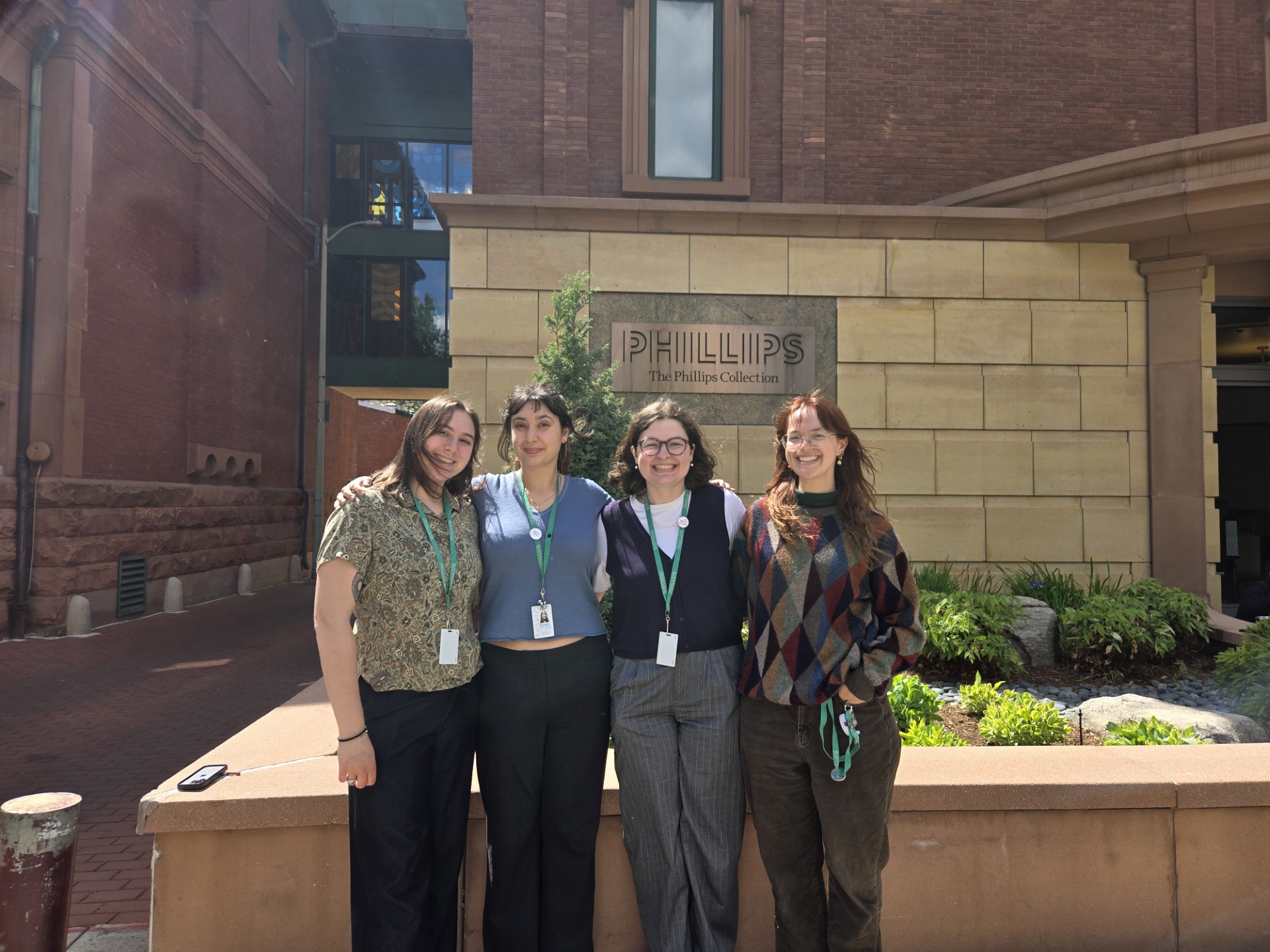 Spring 2026 interns standing outside the museum