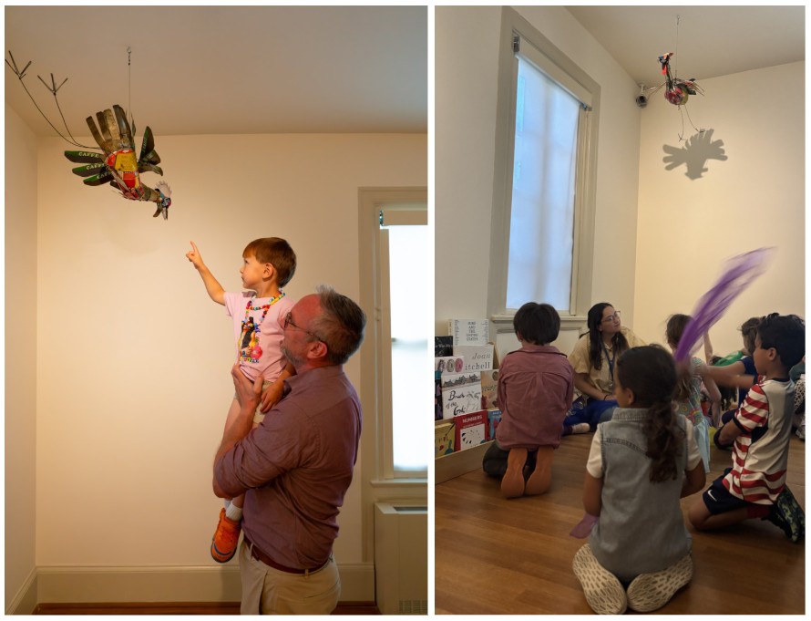 Kids in the Imagination Gallery looking at the sculpture hanging from the ceiling