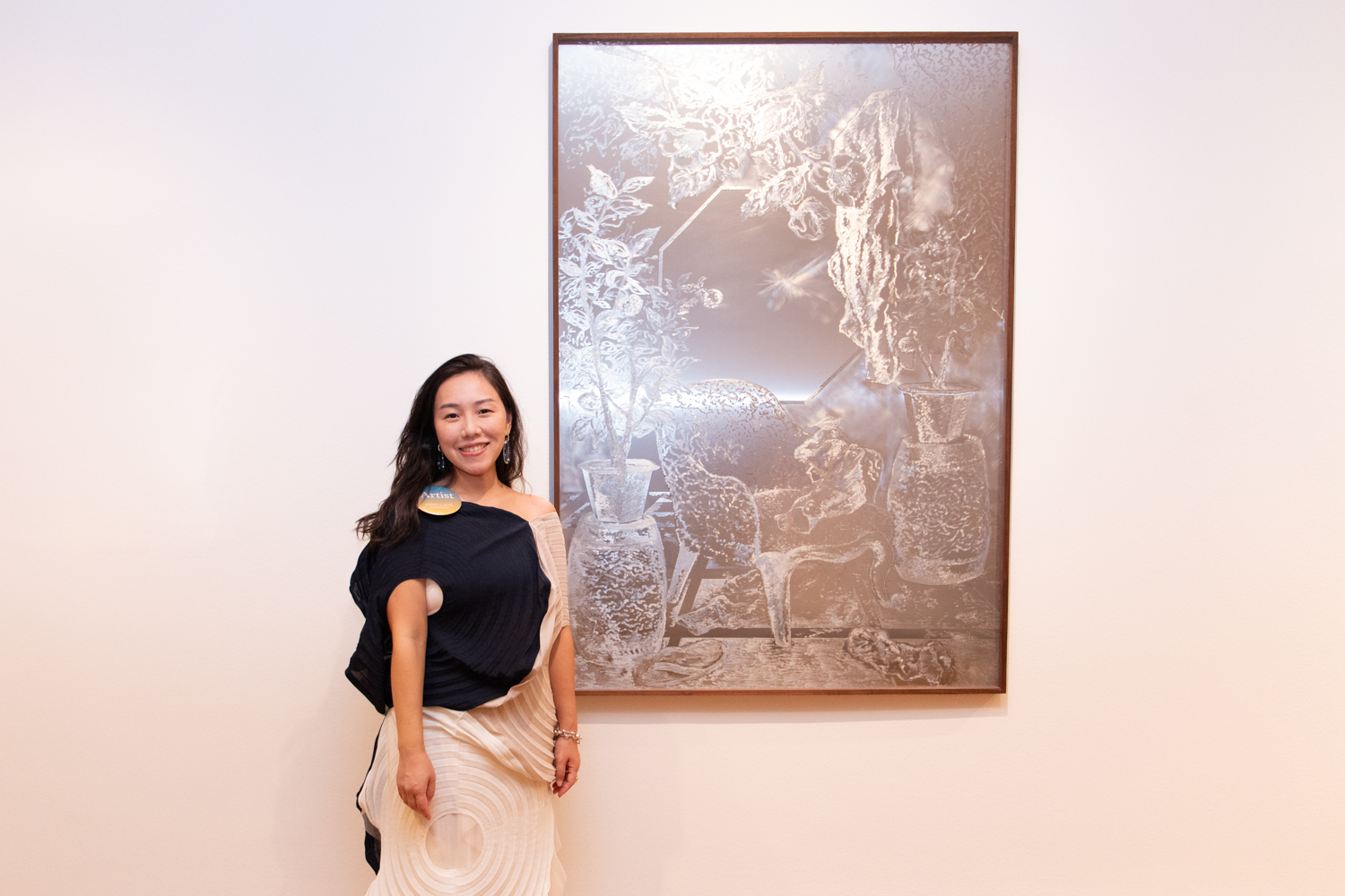 Sharon Cheuk Wun Lee with her artwork on display