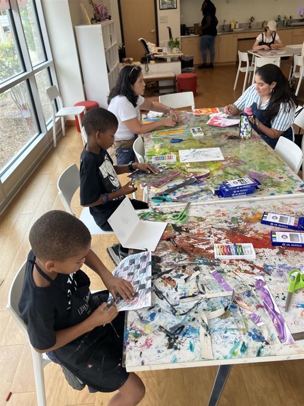 People participating in an art-making workshop at Phillips@THEARC