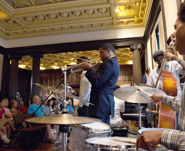Photograph of jazz band performing to a packed room at the Phillips