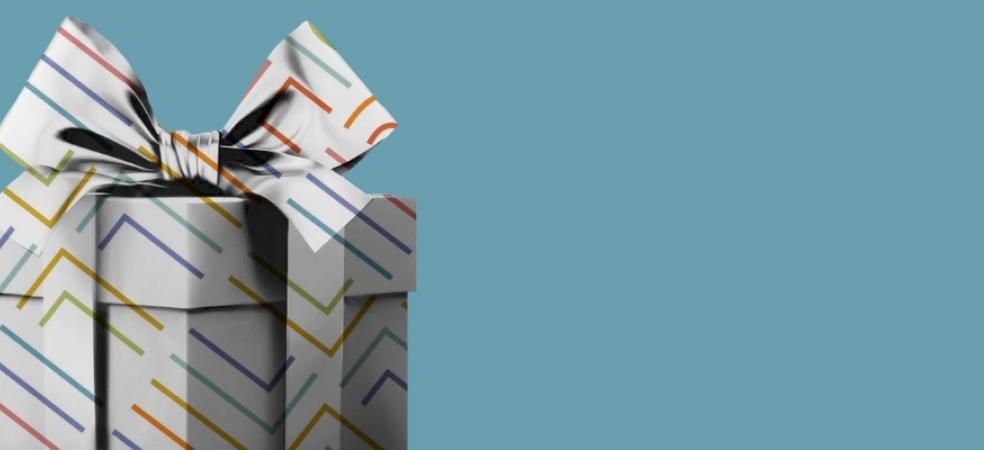 Illustration of present with rainbow wrapping on a blue background