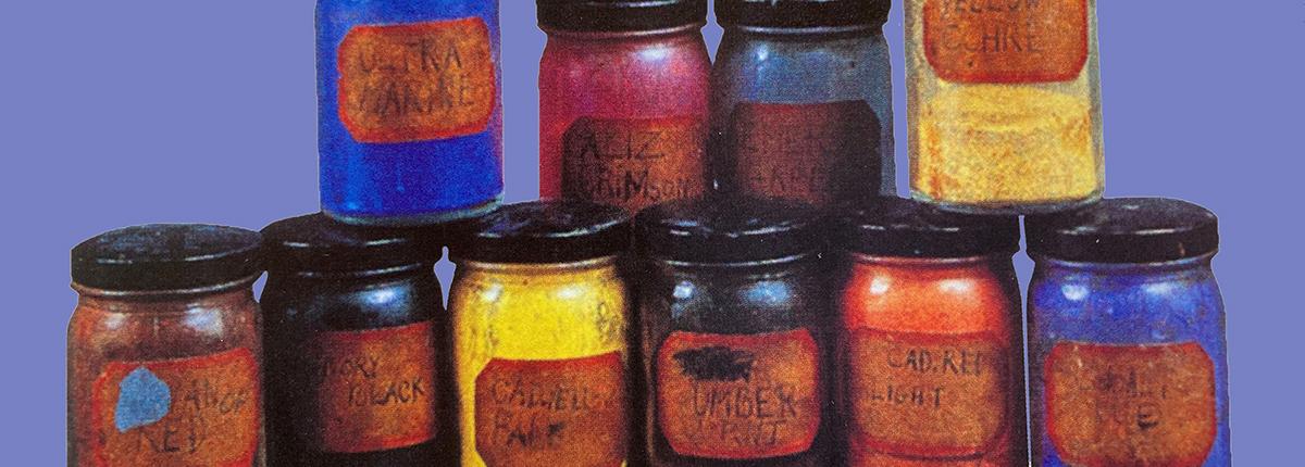 Two rows of 10 jars of paint with different colors or pigments