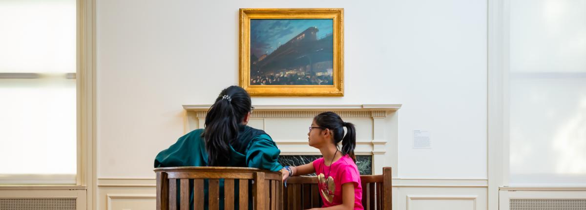 Photograph of two girls sitting in the Phillips parlors