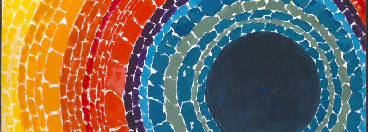 abstract painting with concentric circles in mosaic pattern. Center of circle is a deep dark blue and radiates out with shades of blue, then red, then orange then yellow.