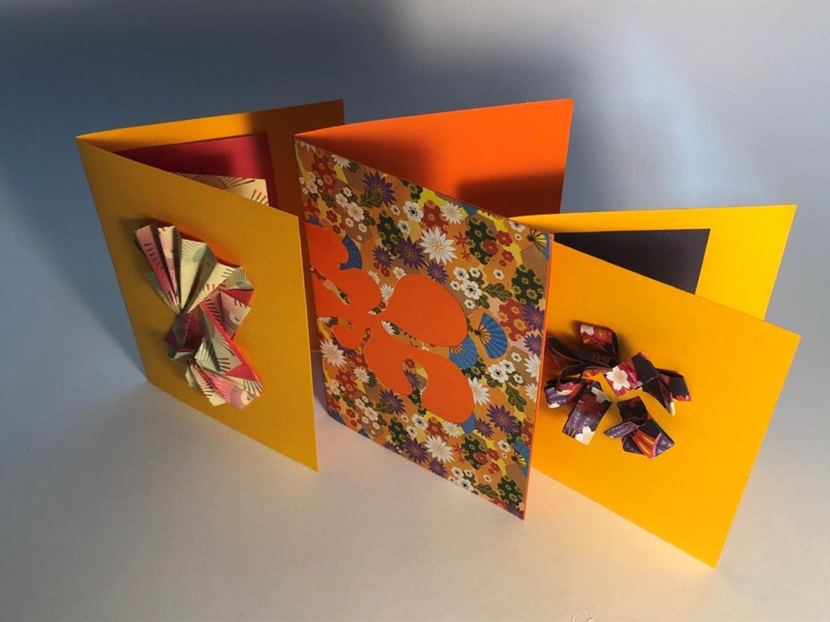 Photograph of orange and yellow paper cards