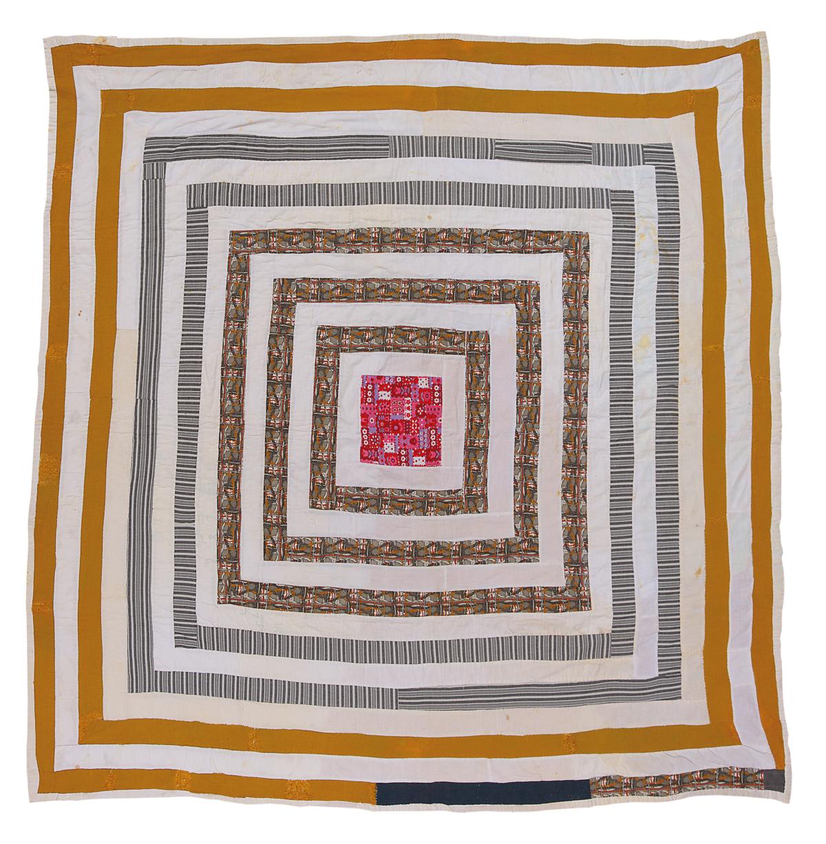 A square quilt made with concentric yellow and white squares with a pink square in the middle