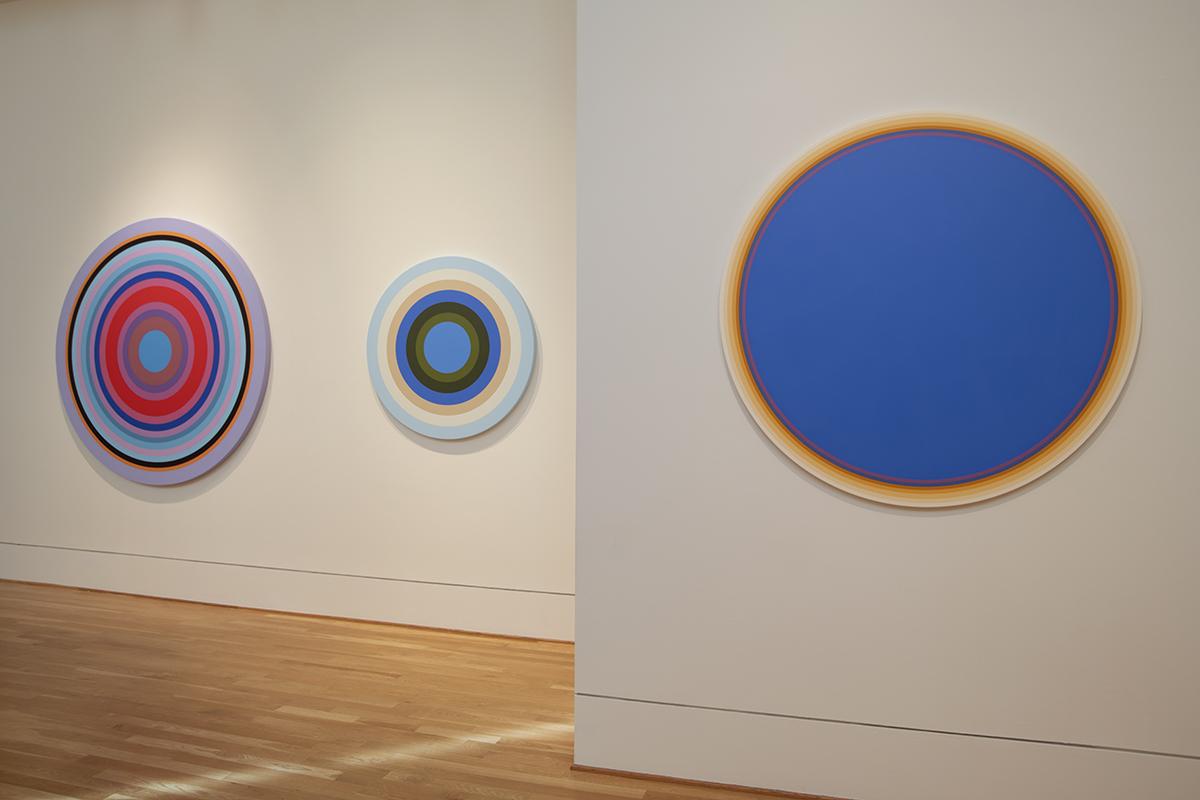 Installation image of Linling Lu: Soundwaves with three colorful circle canvases