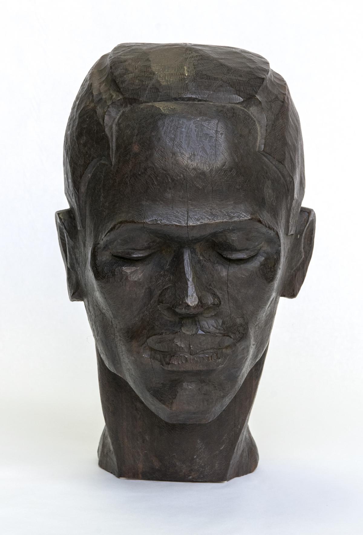 Sculpture of a head of a man with eyes closed