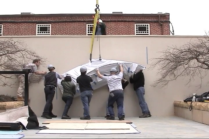 Still from video of installation of Ellsworth Kelly sculpture in courtyard