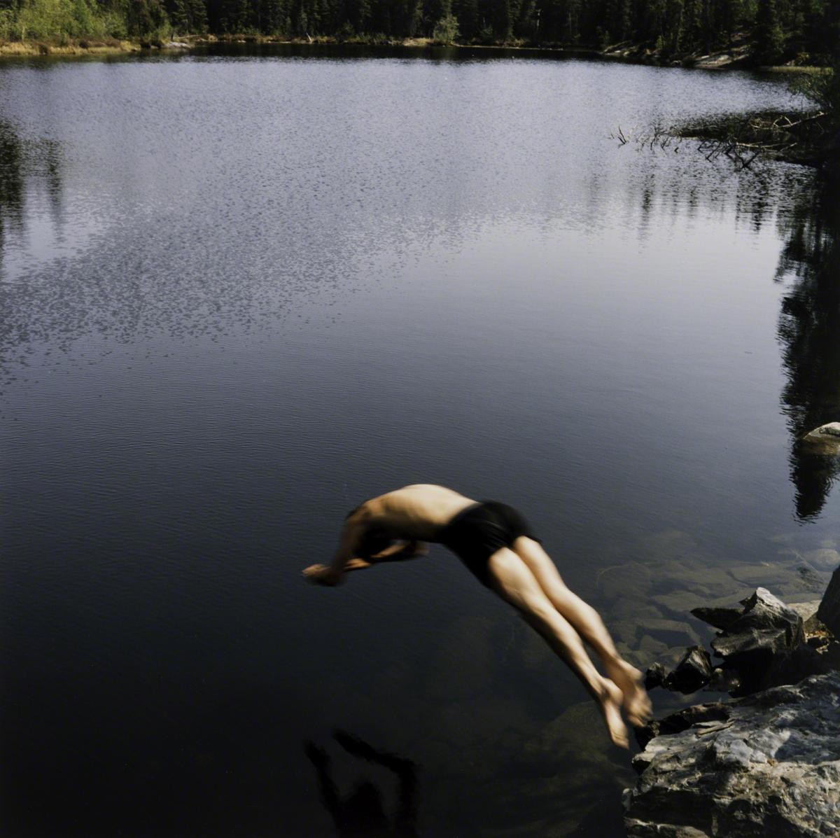 Sarah Anne Johnson, Untitled (Jumping into Lake) (Tree Planting project), 2003.