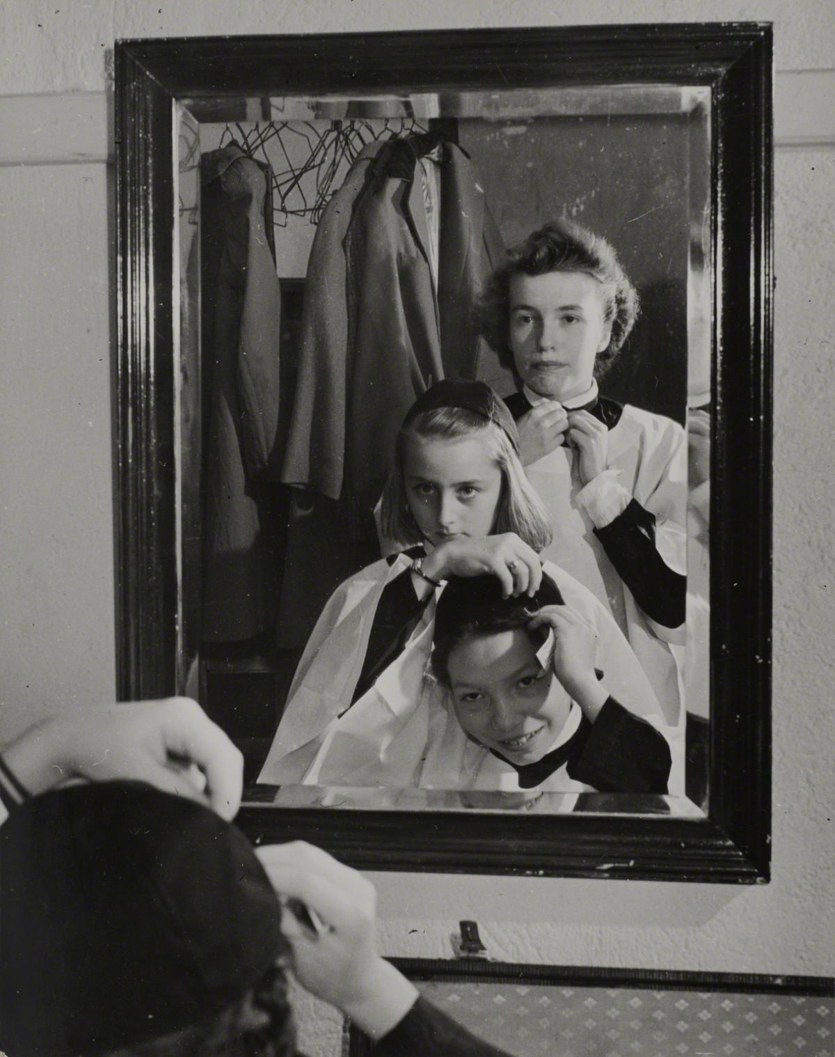 Esther Bubley, Sally Dessee, a Student at Woodrow Wilson High School, Getting Her Robe before Singing with the Choir at Church, Washington, DC, 1943.