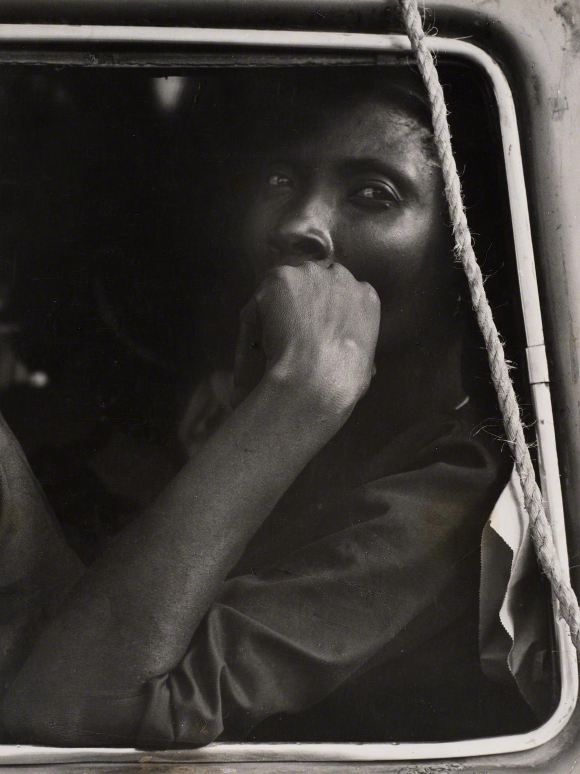 Leon Levinstein, Haiti (man with hand up looking out of car window), 1970s.