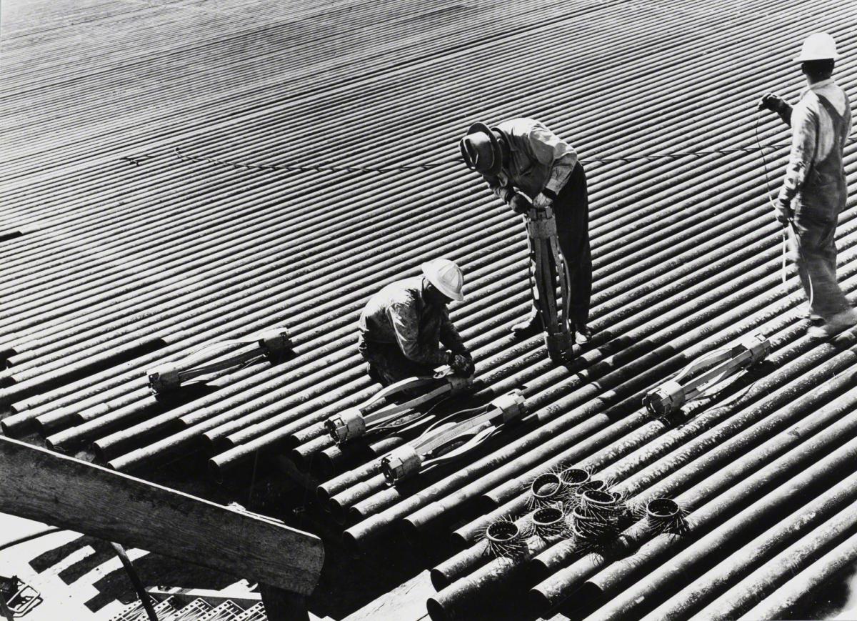 Esther Bubley, Hobbs District, NM, Paddock Field: N.G. Penrose, No. 1 Workman Adjusting Baker Casing Centralizers, 1945.
