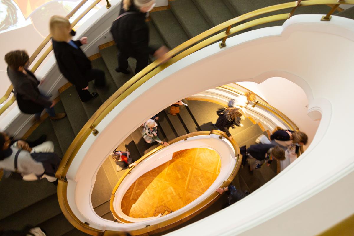 Overhead view of people walking up the Goh Annex spiral stairwell