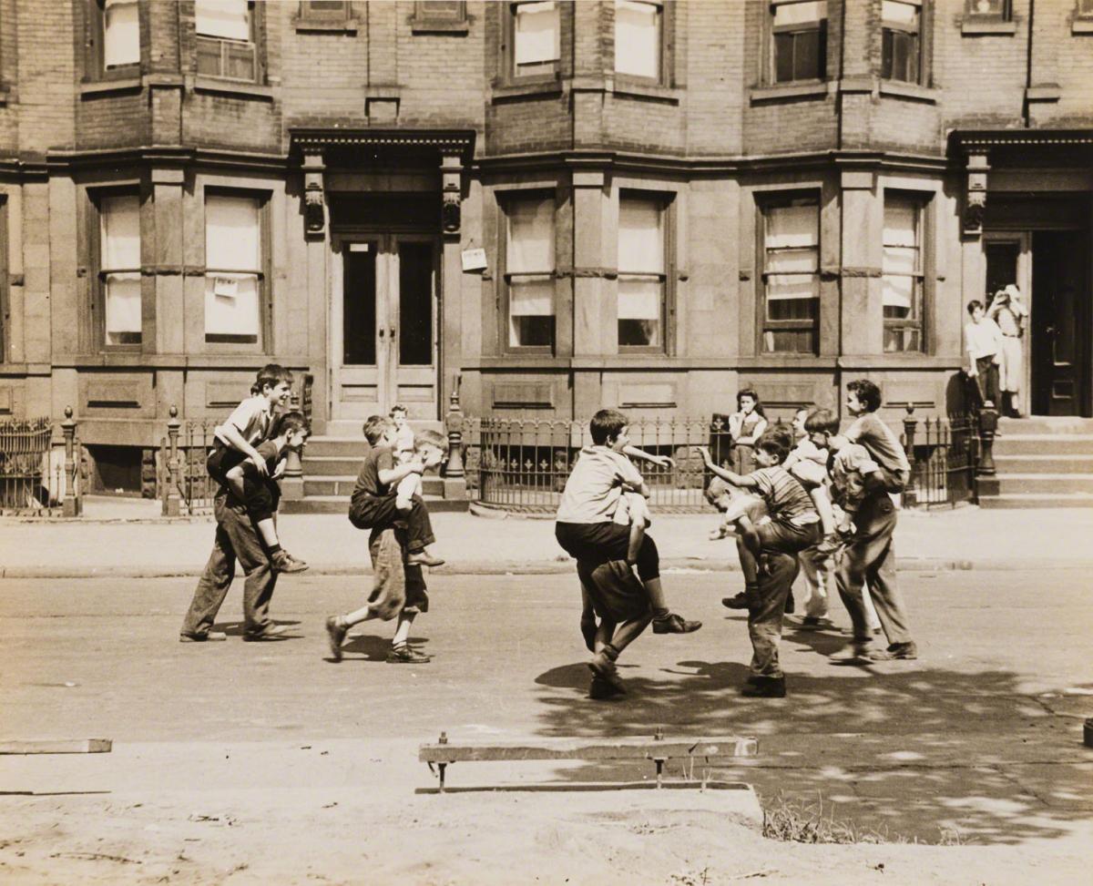 Arthur Leipzig, Untitled (kids giving piggyback rides on street), c. 1943.