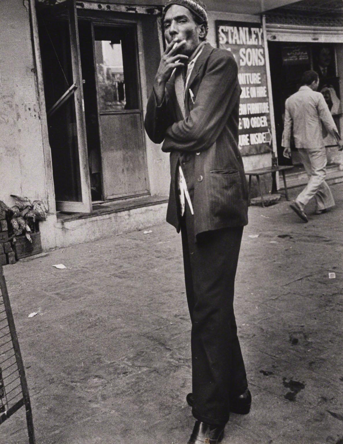 Leon Levinstein, India (man smoking a cigarette), 1970s.