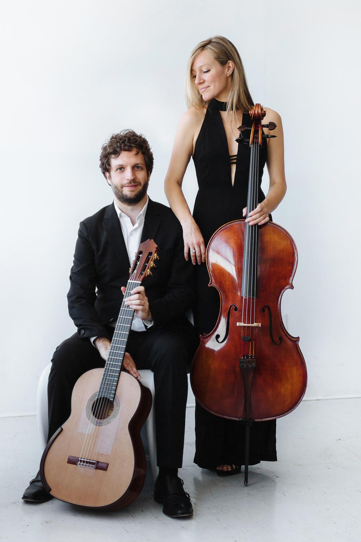 Boyd Meets Girl holding guitar and cello