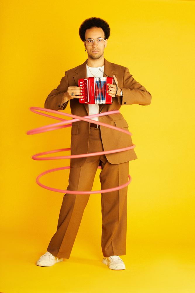 Theo Ould holding a small accordion
