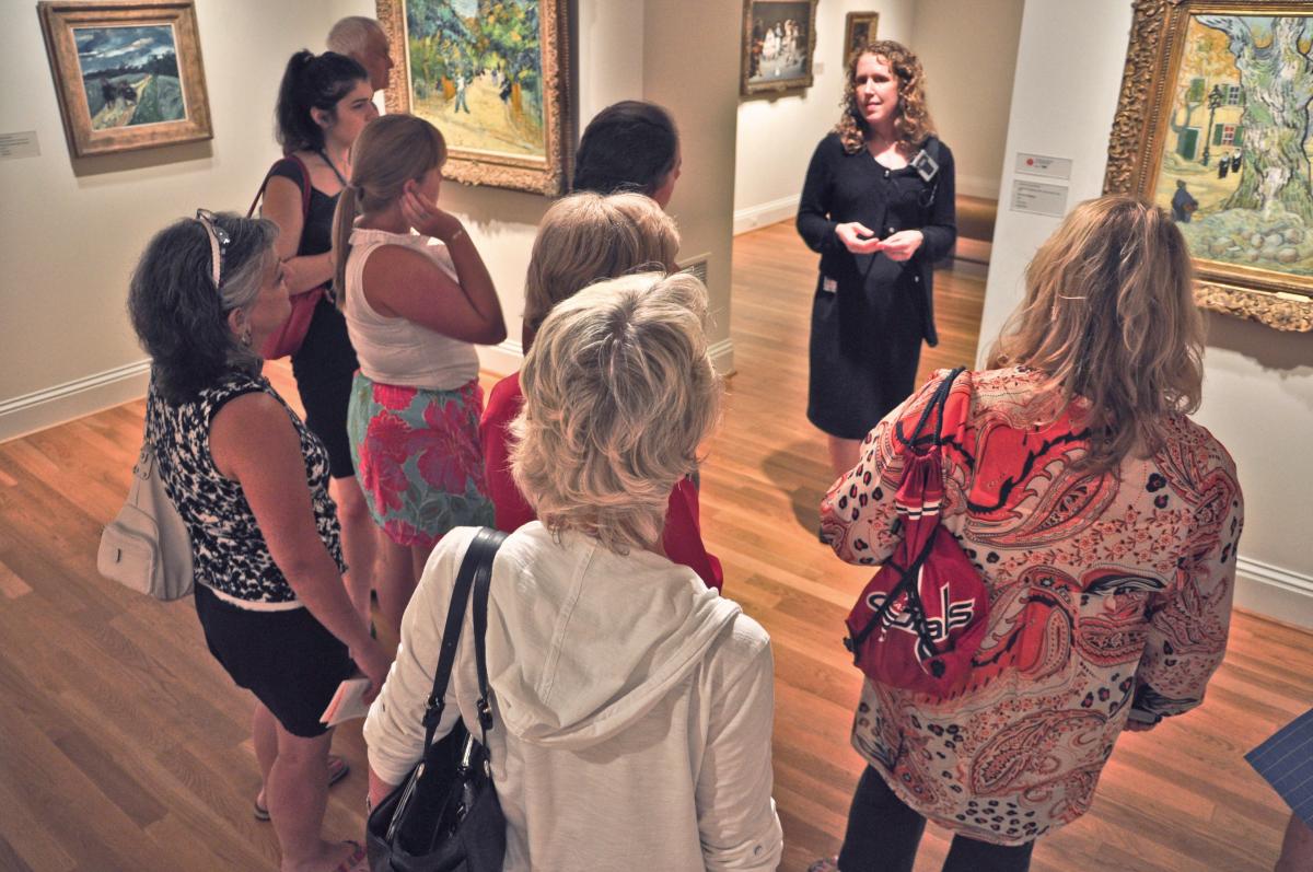 Docent leading a small gallery tour