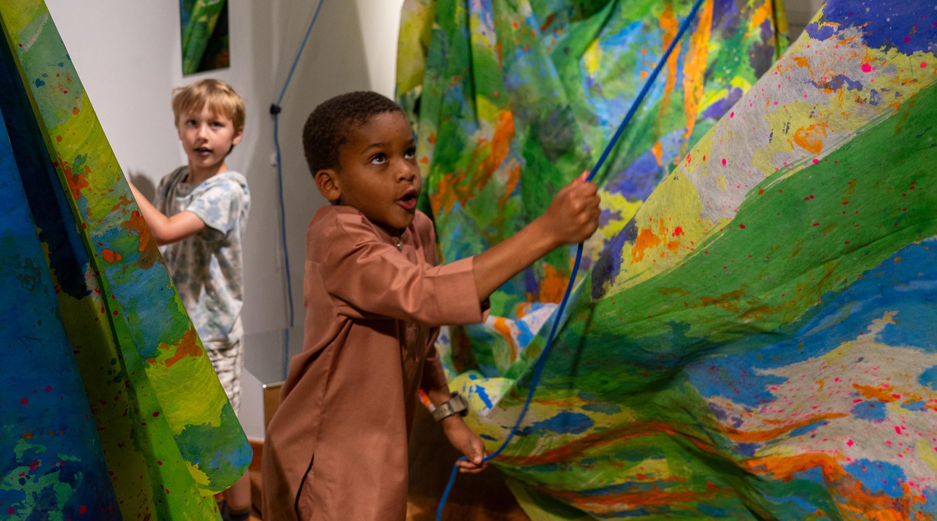 Two kids exploring Art-Play-Practice at THEARC