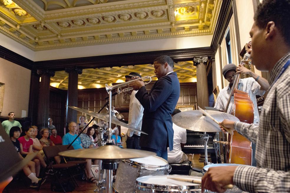 Photograph of jazz band performing to a packed room at the Phillips