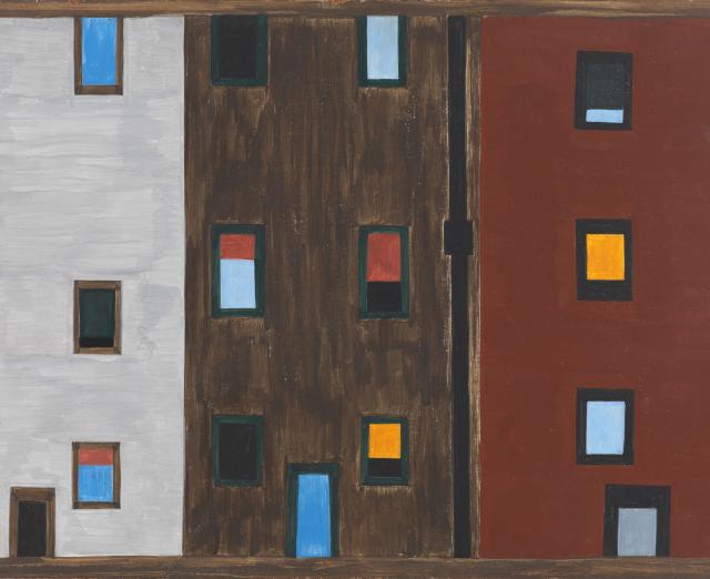 Three high rise apartments, one grey, one dark brown and one rust colored with many colors of windows.