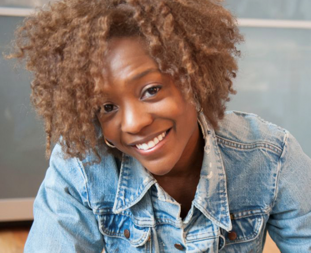 Photo of Nekisha Durrett, a smiling woman wearing a demin jacket