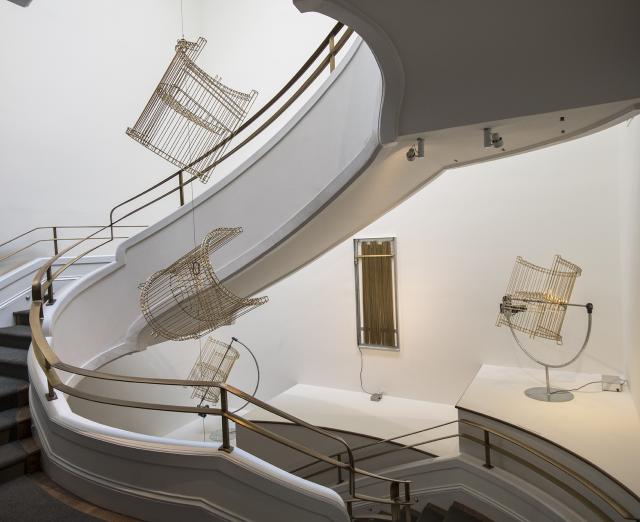 Installation photo of Marley Dawson's ghosts in the Phillips Goh Annex stairwell