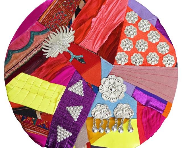 Collage circle made with colorful fabrics and embellishments