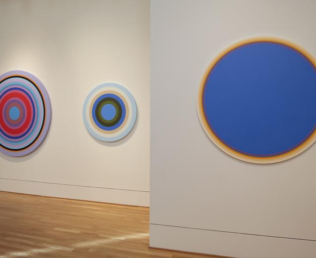 Installation image of Linling Lu: Soundwaves with three colorful circle canvases