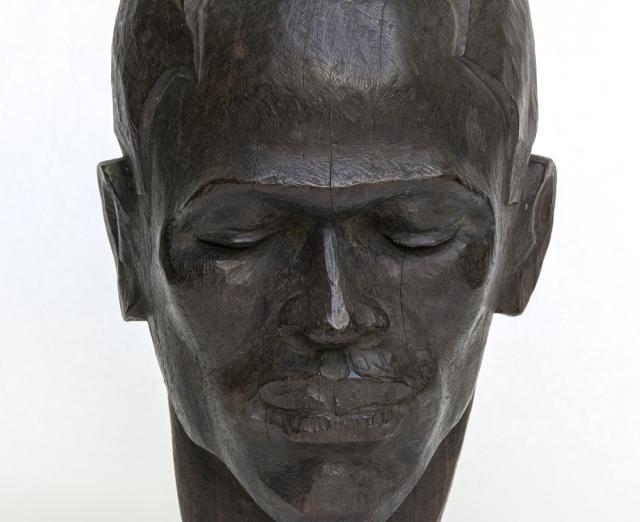 Sculpture of a head of a man with eyes closed