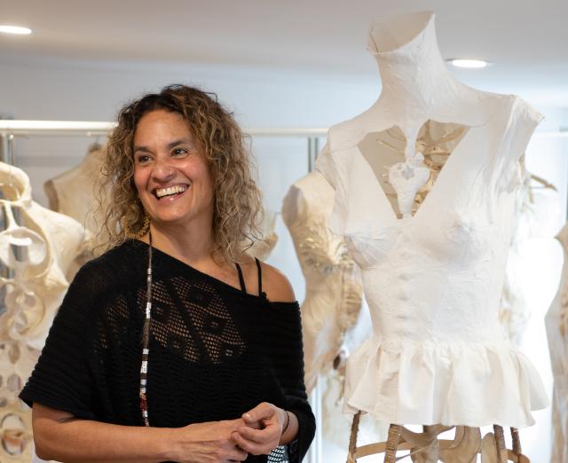 Photograph of Marta Perez Garcia in her studio with her paper sculpture torsos
