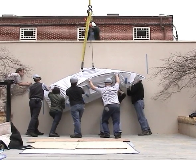 Still from video of installation of Ellsworth Kelly sculpture in courtyard