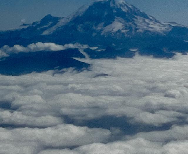 Photograph of clouds and mountaintop