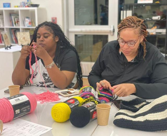 Two women crocheting