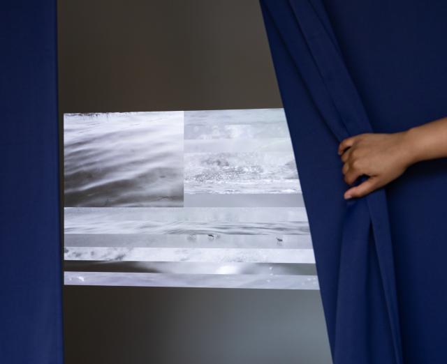 Video installation, indigo dyed curtains, and framed texts