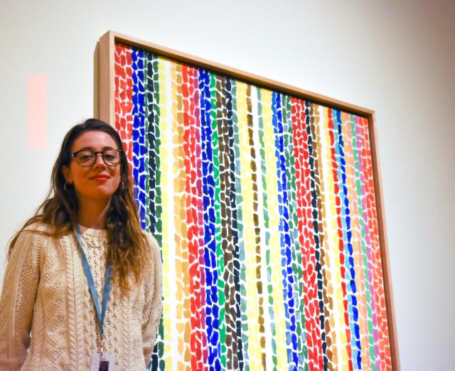 Kathryn Heine, photographed by Kabrea Hayman in front of Alma Thomas' "Breeze Rustling Through Fall Flowers", 1968, 57 7/8 x 50 in.; Acrylic on canvas; The Phillips Collection; Gift of Franz Bader, 1976