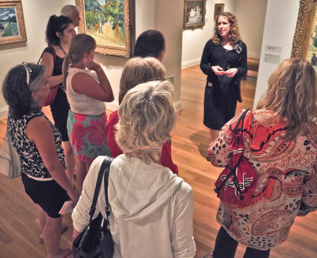 Docent leading a small gallery tour