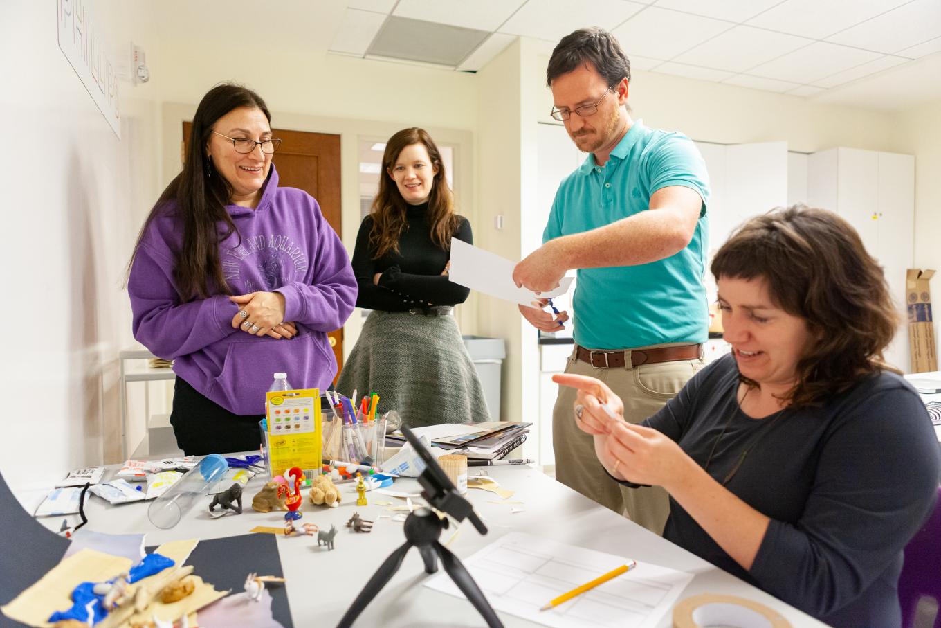 Four educators learning how to use stop-motion animation in the Phillips's art workshop