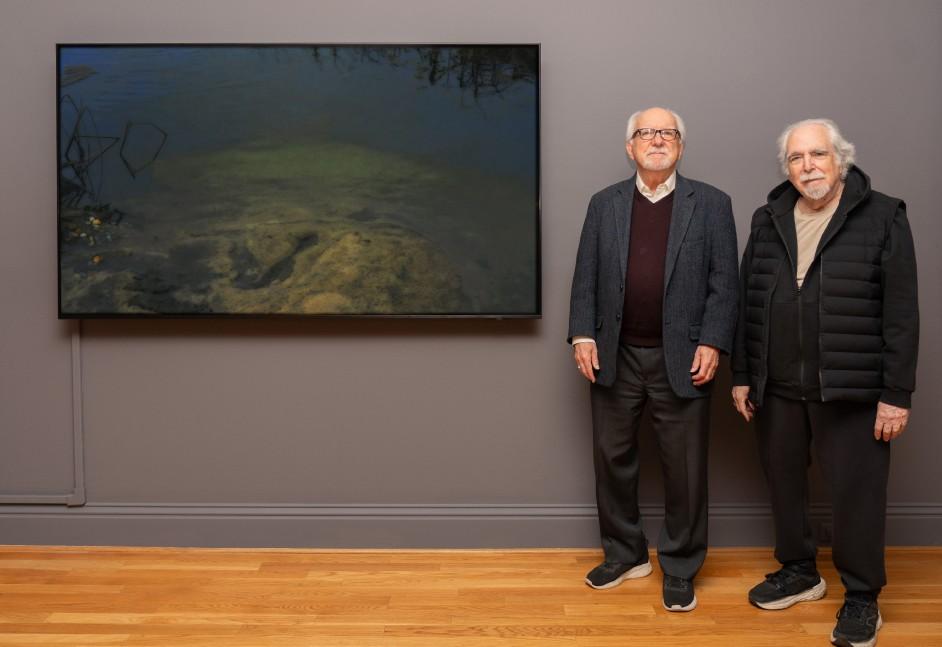 Exhibition curator John Hanhardt and peter campus with campus’s work blessingway