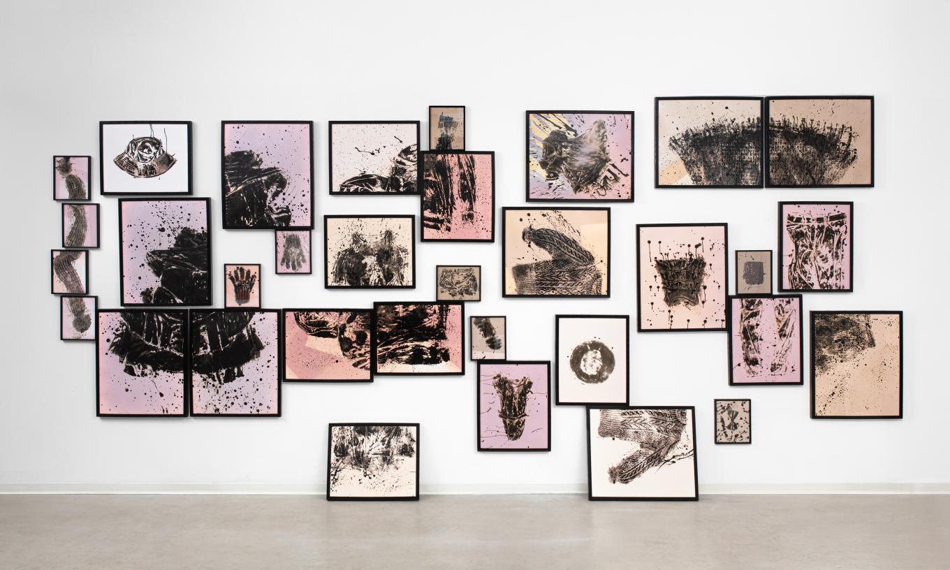 Collage of black and white photograms using various cloths